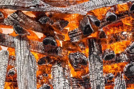 Wood logs arranged as a stack set on fire.のeditorial素材