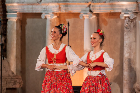 PLOVDIV, BULGARIA - AUGUST 06, 2015 - 21-st international folklore festival in Plovdiv, Bulgaria. The folklore group from Serbia dressed in traditional clothing is preforming Serbian national dances.のeditorial素材