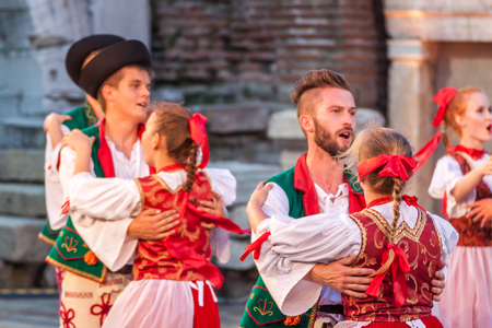 PLOVDIV, BULGARIA - AUGUST 06, 2015 - 21-st international folklore festival in Plovdiv, Bulgaria. The folklore group from Poland dressed in traditional clothing is preforming Polish national dances.のeditorial素材