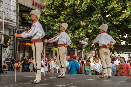PLOVDIV, BULGARIA - AUGUST 06, 2015 - 21-st international folklore festival in Plovdiv, Bulgaria. The folklore group from Serbia dressed in traditional clothing is preforming Serbian national dances.のeditorial素材