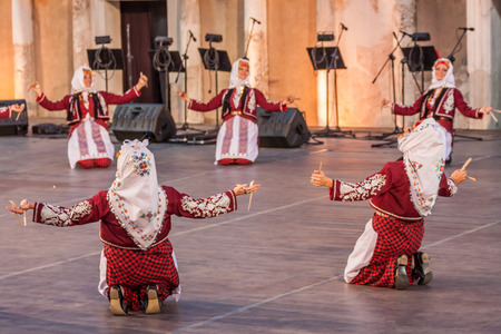 PLOVDIV, BULGARIA - AUGUST 06, 2015 - 21-st international folklore festival in Plovdiv, Bulgaria. The folklore group from Turkey dressed in traditional clothing is preforming Turkish national dances.のeditorial素材