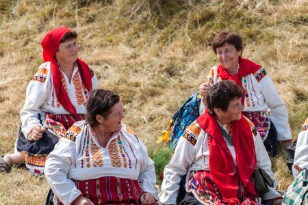 KOPRIVSHTITSA, BULGARIA - AUGUST 08, 2015 - National Festival of the Bulgarian Folklore in Koprivshtitsa, Bulgaria. Folklore groups from different cities dressed in traditional clothing are preforming Bulgarian national dances.のeditorial素材