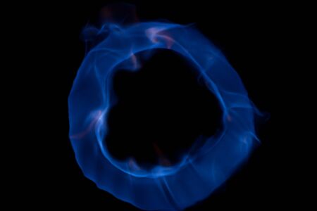Fireball with blue flames isolated on black backgroundの写真素材