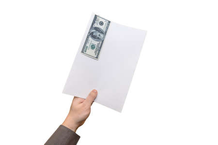 Human hand holding a sheet of paper with a 100 dollar bill on it. The note is attached with a paperclip.の写真素材