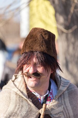 RAKOVSKI, BULGARIA - FEBRUARY 06, 2015 - Kukeri festival in Rakovski, Bulgaria. People dressed in different costumes dance and preform rituals to scare the evel spirits.のeditorial素材