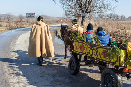 PERUSHTITSA, BULGARIA - FEBRUARY 14, 2015 - Recreating the ritual called Zariazvane in Perushtitsa, Bulgaria. People dressed in traditional clothing dance and cut the vineyards for fruitful harvest.のeditorial素材