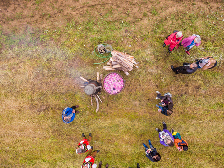 RAZHENA, BULGARIA - MAY 22, 2016 - Aerial view of rose picking ritual in Razhena village. People dressed up in a traditional folklore show a traditional way of preparing rose water and oil.のeditorial素材