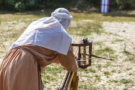 ASENVOGRAD, BULGARIA - JUNE 25, 2016 - Medieval fair in Asenovgrad recreating the life of Bulgarians during the Middle ages. Demonstrating and firing an arrow from a ballista.のeditorial素材
