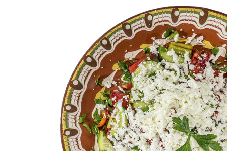 Traditional bulgarian Shopska salad isolated on white bakcground. Made by classic recepie.の写真素材