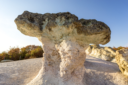 Mushroom rock phenomenton located near Beli Plast village, Bulgaria during sunset with dramatic sky.の写真素材