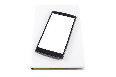 Smartphone and a book isolated on white. New versus old concept.の写真素材