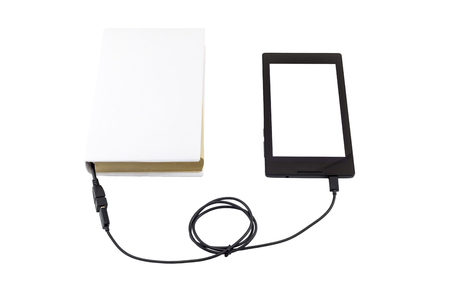 Tablet connected to a book through usb. Isolated on white.の写真素材