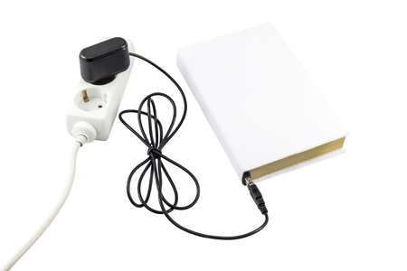 Book with blank cover connected to a USB charger.の写真素材