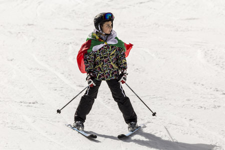 PAMPOROVO, BULGARIA - MARCH 03, 2017 - Skiing with Bulgarian flags at Pamporovo, Bulgaria. People dressed with traditional bulgarian clothes skiing with the national flag.のeditorial素材