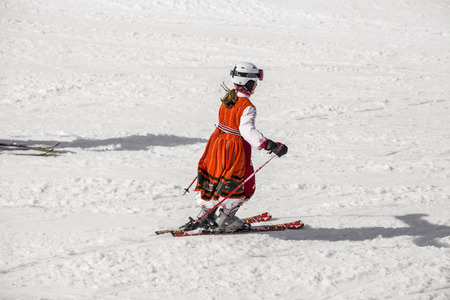 PAMPOROVO, BULGARIA - MARCH 03, 2017 - Skiing with Bulgarian flags at Pamporovo, Bulgaria. People dressed with traditional bulgarian clothes skiing with the national flag.のeditorial素材