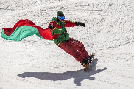 PAMPOROVO, BULGARIA - MARCH 03, 2017 - Skiing with Bulgarian flags at Pamporovo, Bulgaria. People dressed with traditional bulgarian clothes skiing with the national flag.のeditorial素材