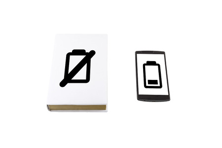 Comparison of a smartphone and a book isolated on white. Battery life concept.の写真素材