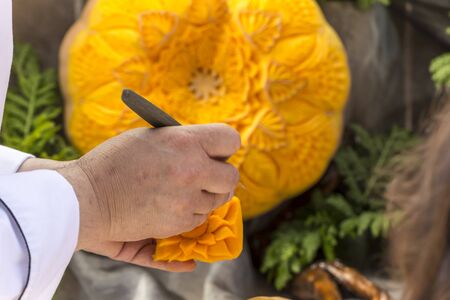 Food carving art decoration made out of pumpkin.の写真素材