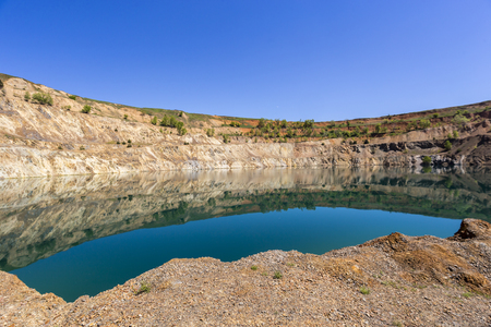 Panoramic view from the bottom of a crater filled with water.の写真素材