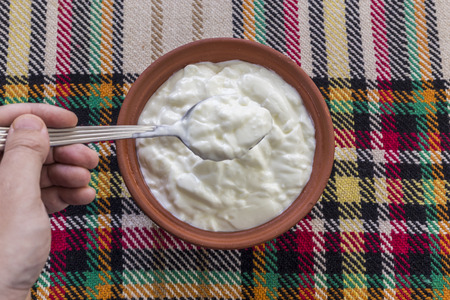 Eating a traditional bulgarian yogurt from a bowl