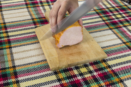 Cutting traditional bulgarian pork smoked filet.の写真素材