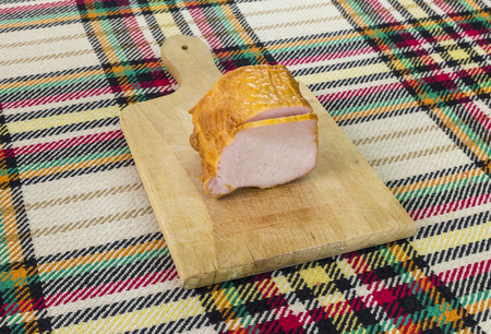 Cutting traditional bulgarian pork smoked filet.の写真素材