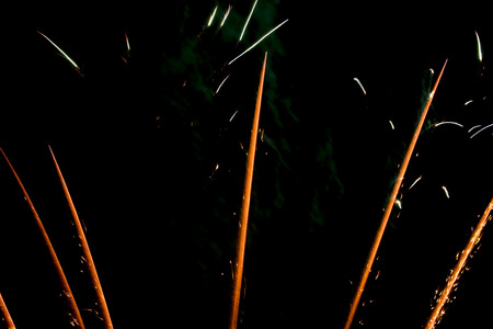 Close-up of a fireworks display. Unique forms and patterns on black background.の写真素材