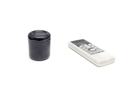 Universal ir and wifi remote with voice activation next to old fashioned remote control with buttons isolated on white background.の写真素材