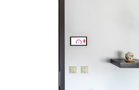 Smart home temperature control concept. Device with software application on screen.の写真素材