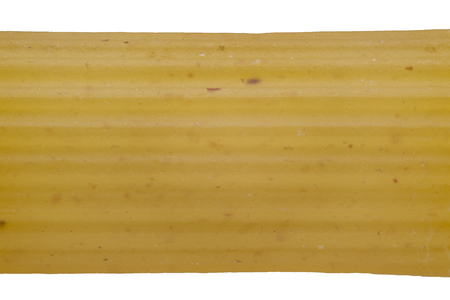 Extreme macro shot of a penne pasta showing the structure of the surface.の写真素材
