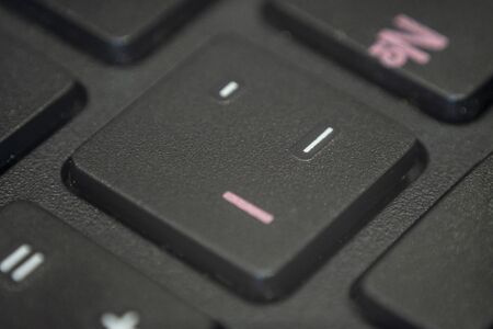 Extreme macro of the dash sign on a laptop keyboardの写真素材
