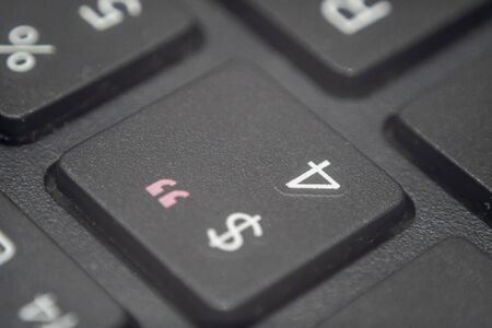 Extreme macro of the number four and dollar sign key on a laptop keyboardの写真素材