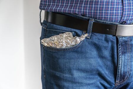 Jeans pocket covered in aluminum foil for protectionの写真素材