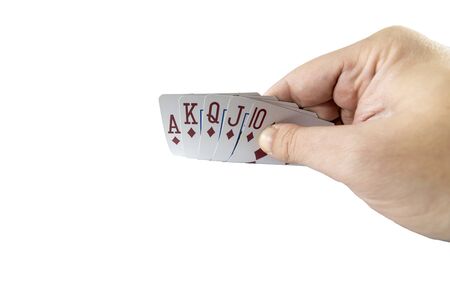 Low angle view of a hand showing poker cards isolated on white background. Gambling concept.の写真素材
