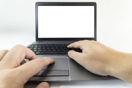 Low angle pow view of a man typing on a laptop keyboardの写真素材