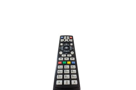 Person poining a TV remote and pressing the power button isolated on white backgroundの写真素材