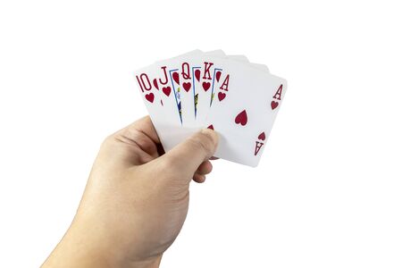 POV view of a man holding playing cards in his hands isolated on white background. Gambling concept.の写真素材