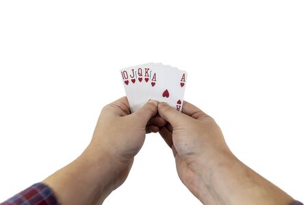 POV view of a man holding playing cards in his hands isolated on white background. Gambling concept.の写真素材
