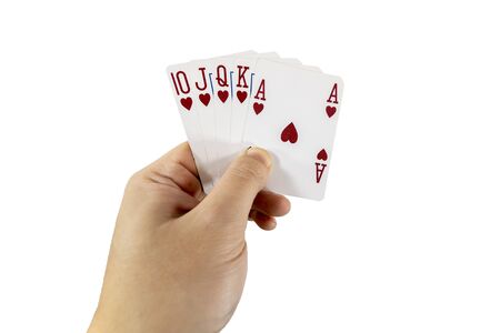 POV view of a man holding playing cards in his hands isolated on white background. Gambling concept.の写真素材