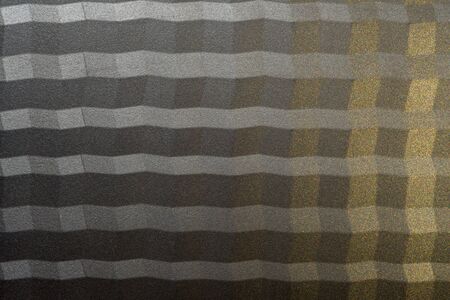 Geometric pattern background with a rough surface and contrasting lightの写真素材