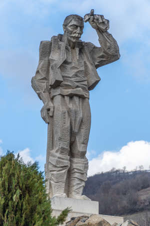 Diado Yotso gleda monument located in the Vratsa region near Ochindol village in Bulgaria. Old person looking at the railway in the distance.のeditorial素材