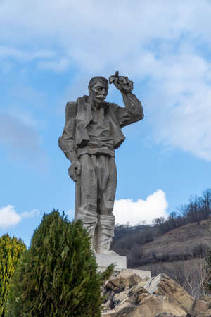 Diado Yotso gleda monument located in the Vratsa region near Ochindol village in Bulgaria. Old person looking at the railway in the distance.のeditorial素材