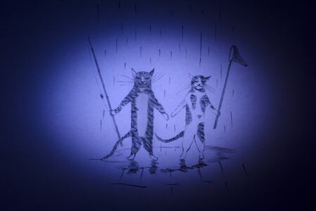 Cat and kitten are going to go fishing with a fishing rod and a netの写真素材