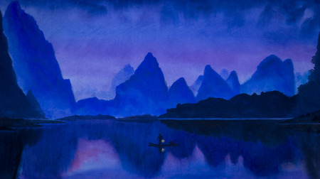 Chinese fisherman with a lamp at dusk and blue mountainsの写真素材