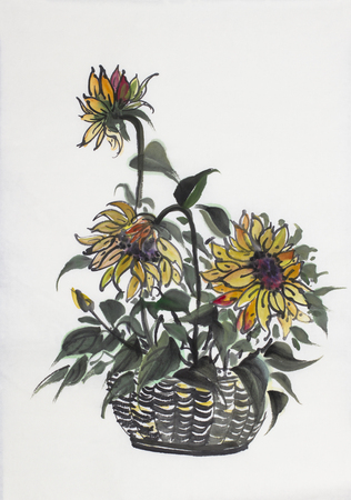 sunflower flowers in a basket on a light backgroundの写真素材