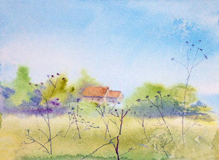 bright spring landscape with field and houseの写真素材