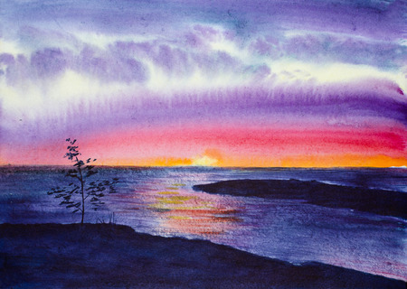 bright summer sunset and rocks on the lakeの写真素材