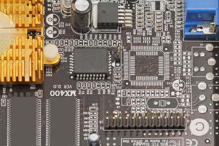 A large electronic card with the chips and other components の写真素材