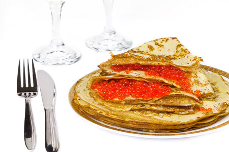 Plate of with pancakes, a knife and fork on a white background. の写真素材