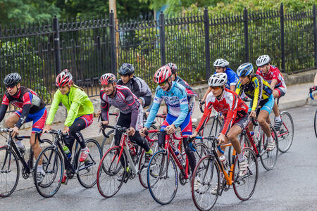 Group of sportsmen in bright sportswear on an urban street.のeditorial素材